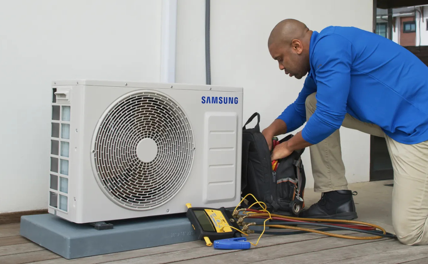 Split unit air conditioner mounted on an interior wall